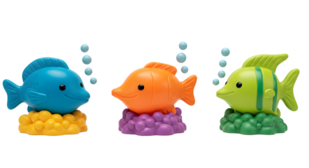 Three colorful toy fish with bubbles on colorful coral on black background
