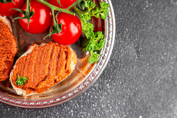 Pepper pate dip red pepper roasted vegetable hummus appetizer vegetable dish fresh gourmet food background on table rustic food top view copy space