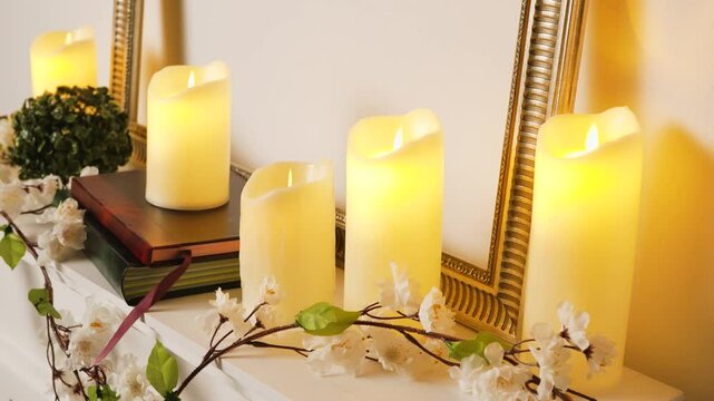 Five candles on a white mantelpiece shie peacefully