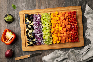 vegetarian food concept, vegetable board with vegetables cut for cooking top view. onion, celery, eggplant, carrot, pumpkin, bell pepper