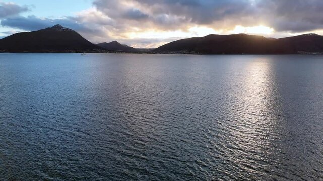 Aerial view of Sulafjorden with silhouetted mountains between the islands of Hareid and Sula