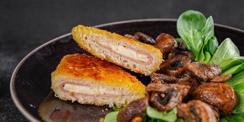 Cordon Bleu Cutlet meat chicken, ham, cheese appetizer dish fresh gourmet food background on the table rustic food top view copy space
