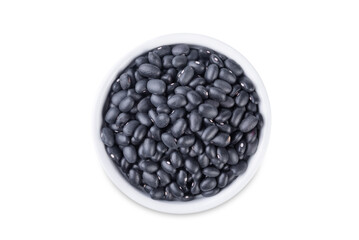 Black beans in a bowl on a white isolated background