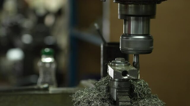VDO 4K Lathe is working on turning metal parts for industrial use.
