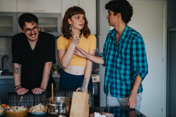 Three friends gather in a modern kitchen, enjoying casual conversation and laughter. The scene...