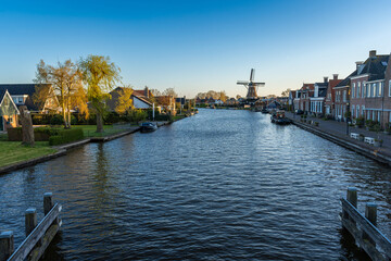 Landscape of Woudsend, Province Friesland, The Netherlands, View of the Ee canal and the historical windmill