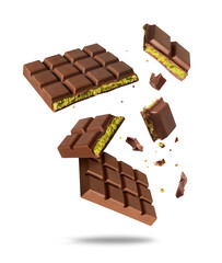 Broken Dubai chocolate in the air isolated on a white background. Dubai chocolate is made with...