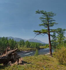 Russia, Republic of Buryatia. Panoramic view of the Tissa mountain river between the picturesque mountains in the Topographers Peak area.