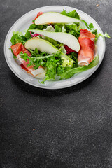 Salad pear ham vegetable dish fresh tasty gourmet food background on the table rustic food top view copy space