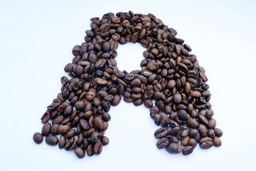 coffee beans on white background, The “А” is lined with coffee beans 