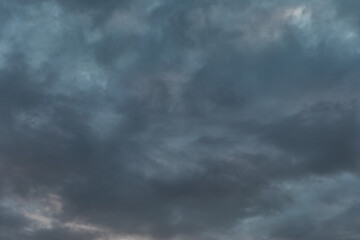 Dark Fluffy Clouds Filling the Moody Sky