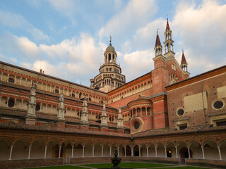 Obraz premium Certosa di Pavia monastery, historical monumental complex that includes a monastery and a sanctuary. green court and a church,Pavia,Italy.