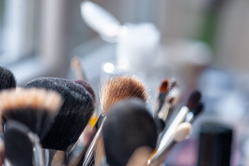 Collection of Makeup Brushes in Soft Natural Light Indoors