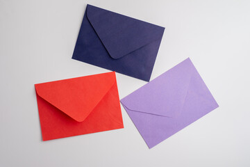 Paper envelopes on a light background. New mail, write a message. Send and receive mail. Postal...