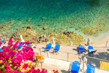 Paleokastritsa beach, small bay and Ionian sea clear water on Korfu, Greece