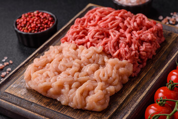 Beef and chicken minced meat, ground of two types fresh raw with salt and spices