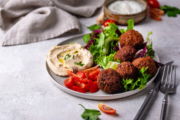 Salad with hummus, falafel and vegetables