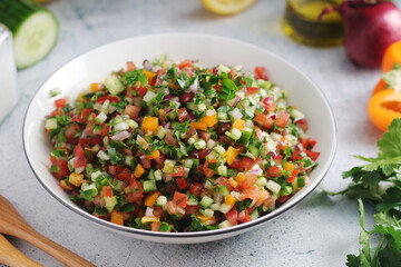 A bowl with traditional Israeli Salad