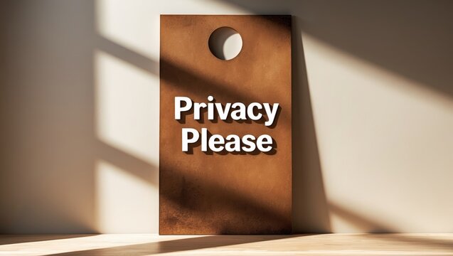 Still-life image of a door sign requesting privacy