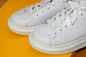 white sneaker,  colored  background. sport shoes,   Lifestyle sneaker sport shoe. Stylish white sneaker