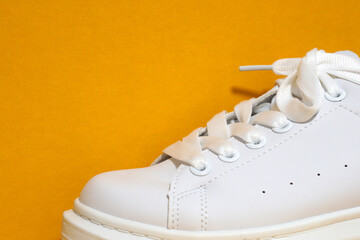 white sneaker,  colored  surface. sport shoes,