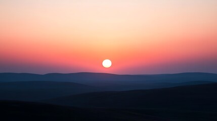 Sunrise over rolling hills.
