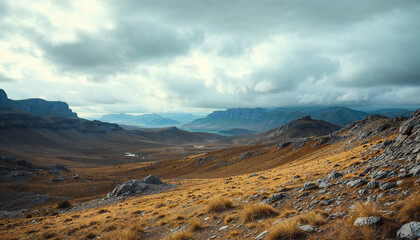 Mountain Valley Landscape: A breathtaking panoramic view of a vast mountain valley, showcasing dramatic cloud formations overhead and a rugged, rocky terrain below.