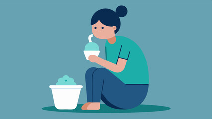 Emotional Eating A person sitting alone with a tub of ice cream and a sad expression highlighting the relationship between emotions and unhealthy eating habits.
