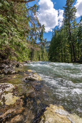 Majestic mountain creek with rocky background in Vancouver, Canada, North America. Day time on July 2024.