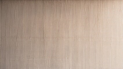 Fototapeta premium Close-up view of a textured wallpaper background. Wallpaper featuring a diagonal weave pattern. This image presents a close-up perspective of wallpaper displaying an intricate diagonal weave design.