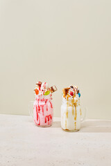 Colorful Monster Milkshakes in Bright Studio Setting with Soft Contrast and Playful Composition
