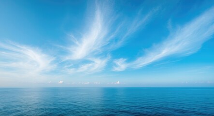 Azure ocean beneath a cloudy sky.