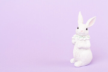 Cute white easter bunny on color background