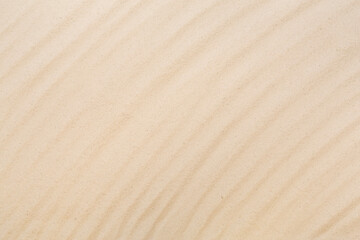 Textured beach sand as background, top view