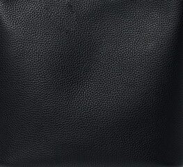 Close-up of black textured leather surface showing detailed grain pattern