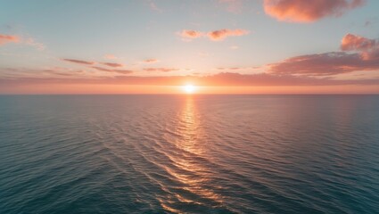 Fototapeta premium Experience the ethereal fusion of sea and sky at sunset from a captivating aerial viewpoint, captured by a droneâ€™s lens. Flight above the ocean.