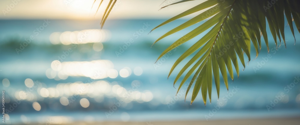 Poster fuzzy beautiful nature green palm leaf on coastal beach with bokeh sunlight wave conceptual backgrou