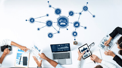 A vibrant modern office setup illustrating teamwork with multiple devices displaying business...
