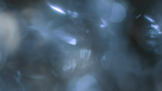 Abstract blurred background with a boke effect. Refraction of light from a crystal. Background animation is a flash of light. the effect of soft, unfocused, flickering light streams