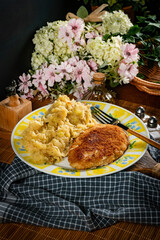 Minced meat cutlet with boiled sauerkraut.