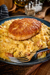 Minced meat cutlet with boiled sauerkraut.