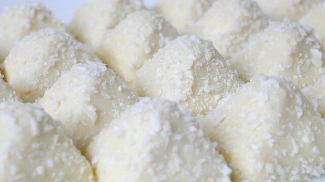 Candy wrapped in coconut chips. A delicious dessert of crispy waffles, sweet, delicate cream sprinkled with coconut chips