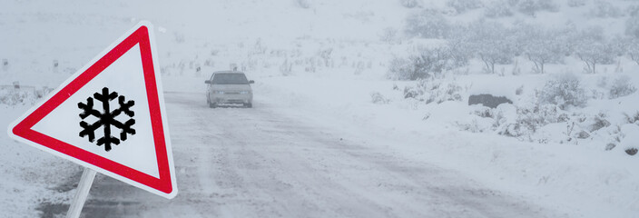 Warning Sign for First Snow and Driving in Fog with Reduced Visibility and Slippery Roads.