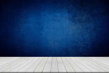 Empty table on dark blue texture wall background. Composition with organic shadow on the wall and light reflections. Mock up for presentation, branding products, cosmetics food or jewelry.