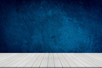 Empty table on dark blue texture wall background. Composition with organic shadow on the wall and light reflections. Mock up for presentation, branding products, cosmetics food or jewelry.