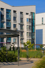 City view on a sunny day. Modern houses against the blue sky.