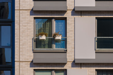 Cityscape on a summer day, modern buildings and houses 