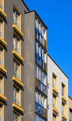 Cityscape on a summer day, modern buildings and houses 