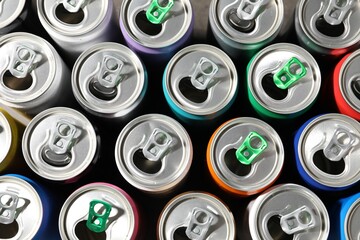 Many aluminium cans of beverage as background, top view