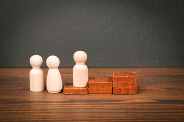 Growth Concept with Wooden Figures and Stacked Blocks